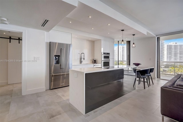 20191 E Country Club Dr Unit 802, Aventura, FL 33180 - kitchen with white cabinets, visible vents, modern cabinets, appliances with stainless steel finishes, and a sink
