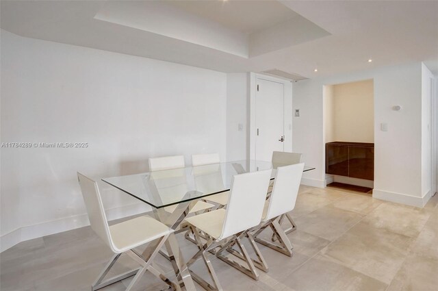 20191 E Country Club Dr Unit 802, Aventura, FL 33180 - dining room with a tray ceiling, baseboards, and recessed lighting