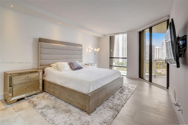 20191 E Country Club Dr Unit 802, Aventura, FL 33180 - bedroom with access to outside, floor to ceiling windows, and baseboards