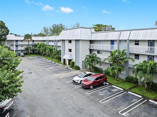 3000 Riverside Dr Unit 309-1, Coral Springs, FL 33065 - uncovered parking lot featuring a residential view