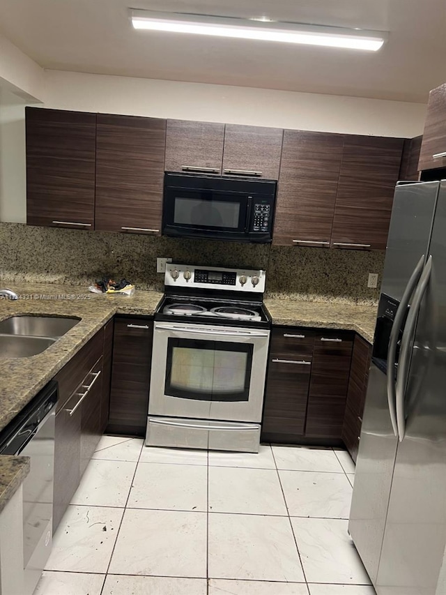 5955 NW 25th Ct Unit 208, Sunrise, FL 33313 - kitchen featuring stainless steel appliances, tasteful backsplash, modern cabinets, and dark brown cabinets
