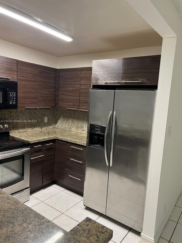 5955 NW 25th Ct Unit 208, Sunrise, FL 33313 - kitchen featuring stainless steel appliances, light tile patterned flooring, decorative backsplash, dark brown cabinets, and modern cabinets