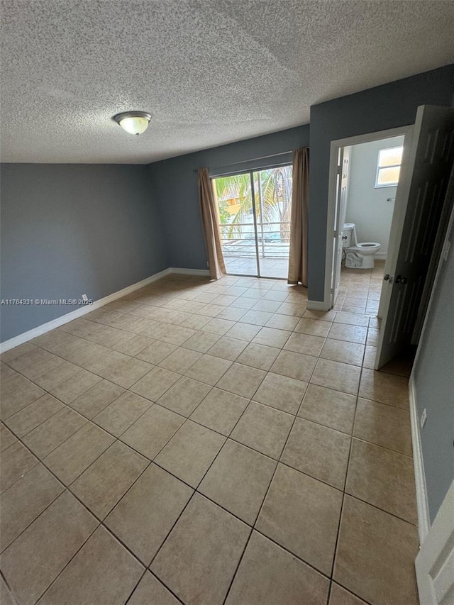 5955 NW 25th Ct Unit 208, Sunrise, FL 33313 - unfurnished room with light tile patterned flooring and a textured ceiling