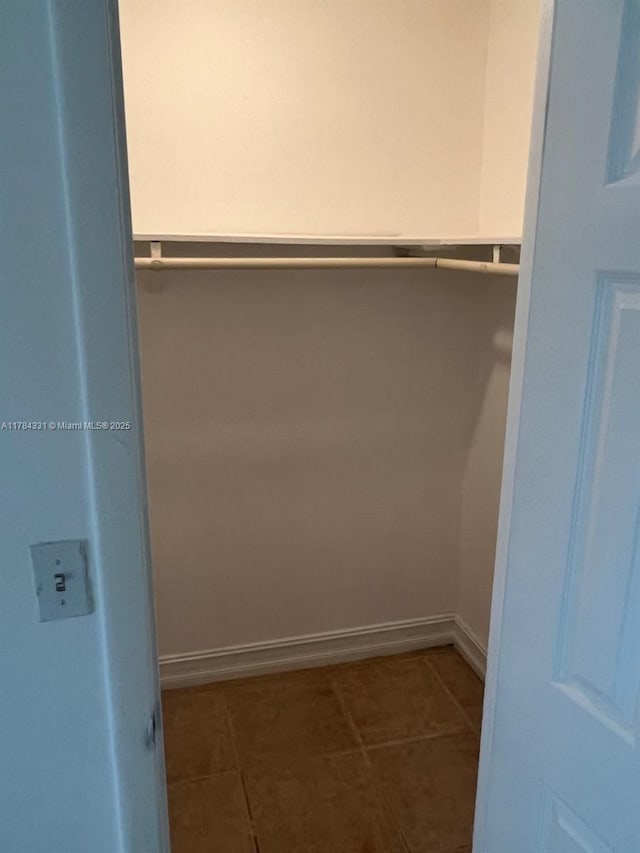 5955 NW 25th Ct Unit 208, Sunrise, FL 33313 - spacious closet featuring tile patterned floors