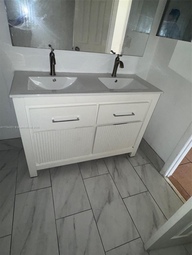 5955 NW 25th Ct Unit 208, Sunrise, FL 33313 - full bathroom featuring marble finish flooring and double vanity