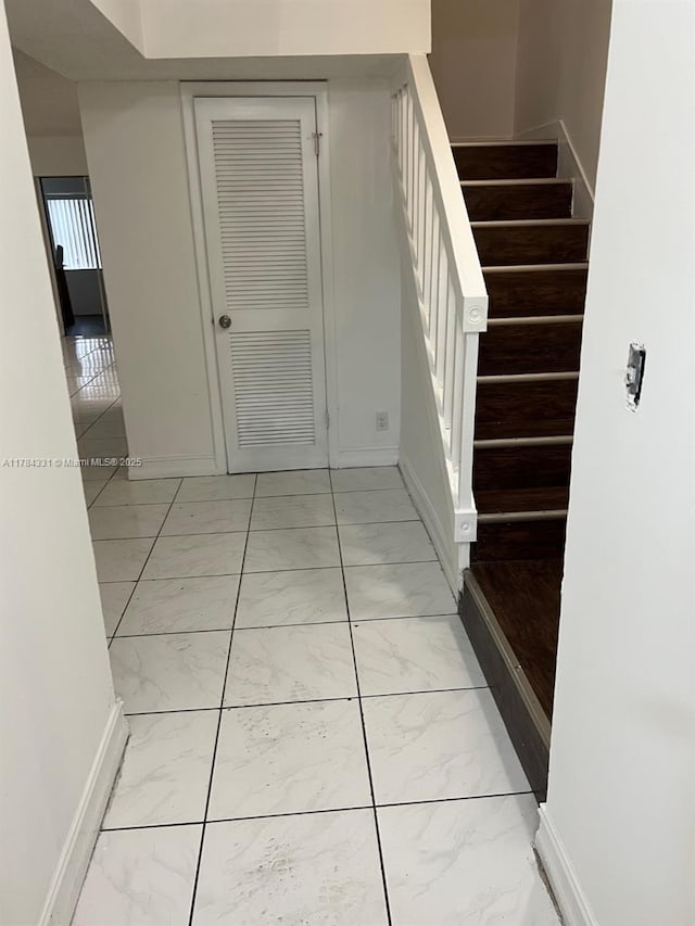 5955 NW 25th Ct Unit 208, Sunrise, FL 33313 - hall with light marble finish flooring and stairs