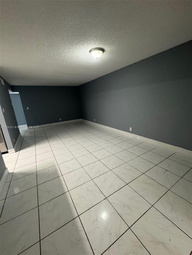 5955 NW 25th Ct Unit 208, Sunrise, FL 33313 - unfurnished room with a textured ceiling and baseboards