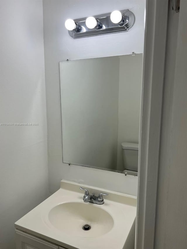 5955 NW 25th Ct Unit 208, Sunrise, FL 33313 - half bathroom featuring vanity and toilet