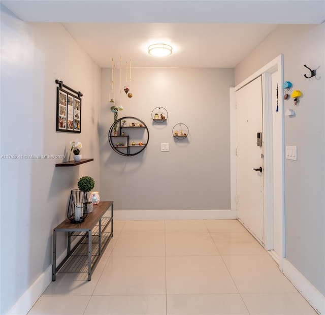 1000 NE 204th Ln, Miami, FL 33179 - hallway with tile patterned floors and baseboards