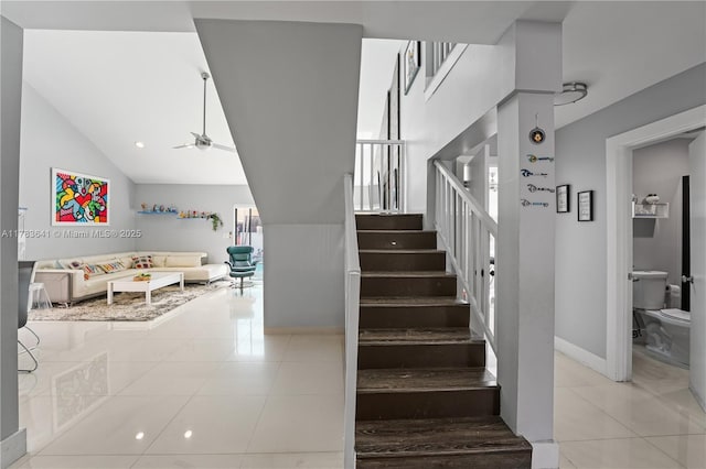 1000 NE 204th Ln, Miami, FL 33179 - staircase with ceiling fan, lofted ceiling, tile patterned floors, and baseboards