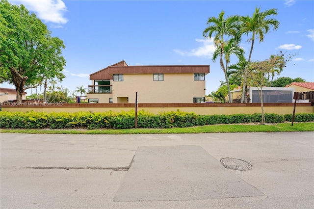 1000 NE 204th Ln, Miami, FL 33179 - view of home's exterior featuring stucco siding and fence