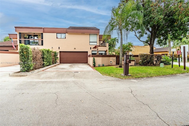 1000 NE 204th Ln, Miami, FL 33179 - view of front facade with a garage, concrete driveway, and stucco siding