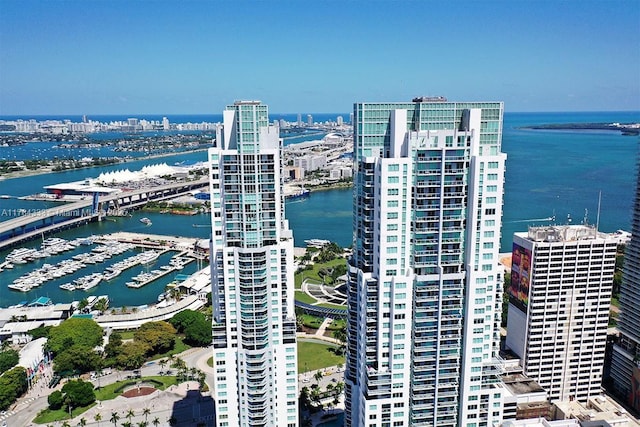 birds eye view of property with a view of city and a water view