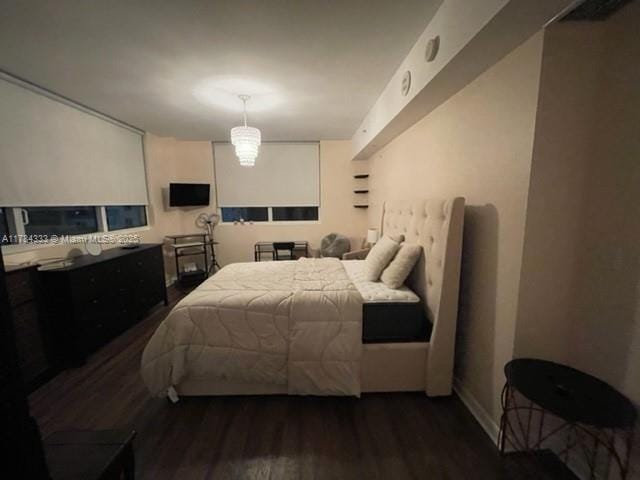 bedroom with wood finished floors