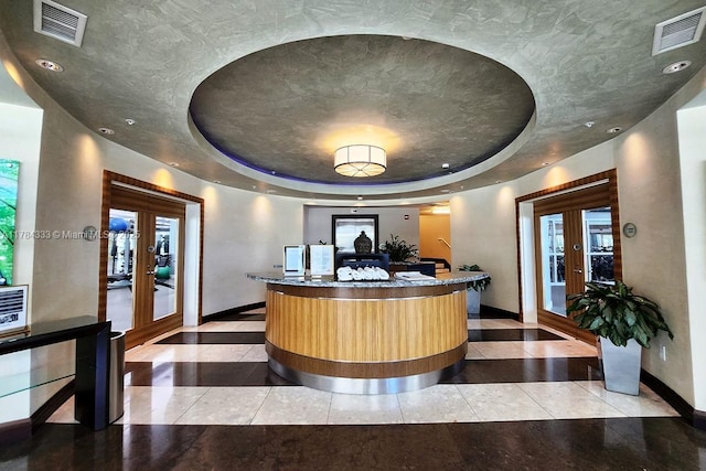 reception area with french doors and visible vents