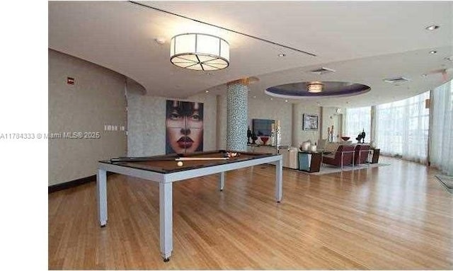 game room with pool table, wood finished floors, and expansive windows