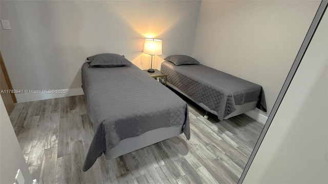 400 SE Sunny Isles Blvd Unit 1702, Sunny Isles Beach, FL 33160 - bedroom featuring wood finished floors