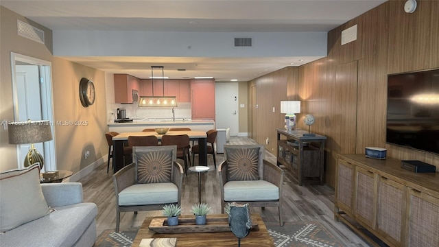 400 SE Sunny Isles Blvd Unit 1702, Sunny Isles Beach, FL 33160 - living room featuring light wood-style floors and baseboards