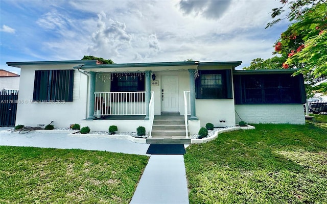 5080 E 5th Ave, Hialeah, FL 33013 - view of front of home featuring covered porch