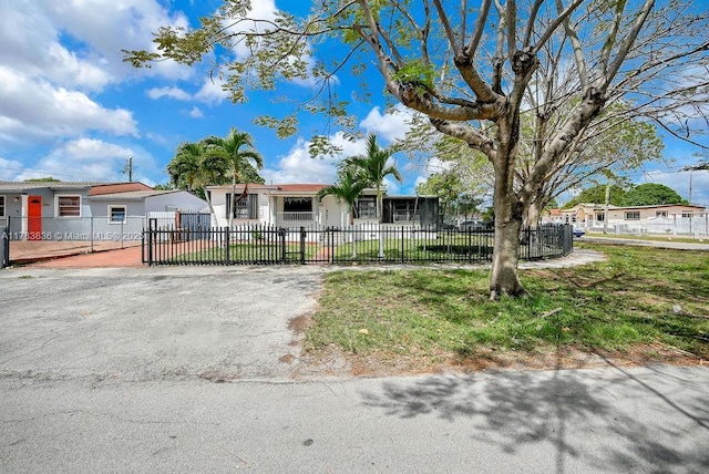 5080 E 5th Ave, Hialeah, FL 33013 - single story home featuring a fenced front yard