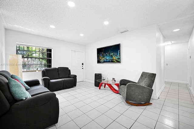 5080 E 5th Ave, Hialeah, FL 33013 - living area featuring recessed lighting, a textured ceiling, and light tile patterned flooring