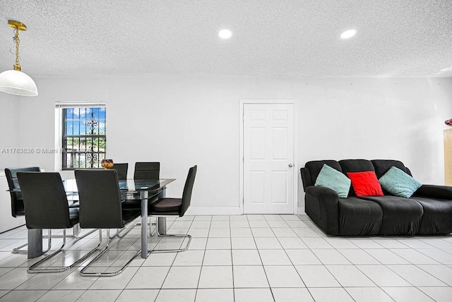 5080 E 5th Ave, Hialeah, FL 33013 - dining room featuring a textured ceiling, recessed lighting, and light tile patterned floors