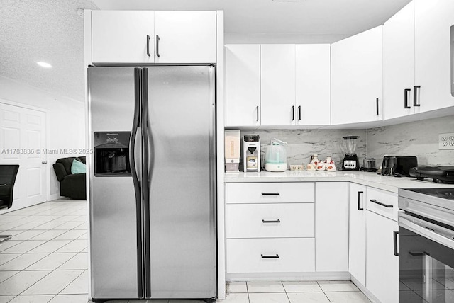 5080 E 5th Ave, Hialeah, FL 33013 - kitchen featuring stainless steel fridge with ice dispenser, light countertops, white cabinetry, stove, and backsplash