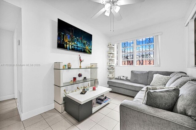 5080 E 5th Ave, Hialeah, FL 33013 - living area with ceiling fan and light tile patterned floors