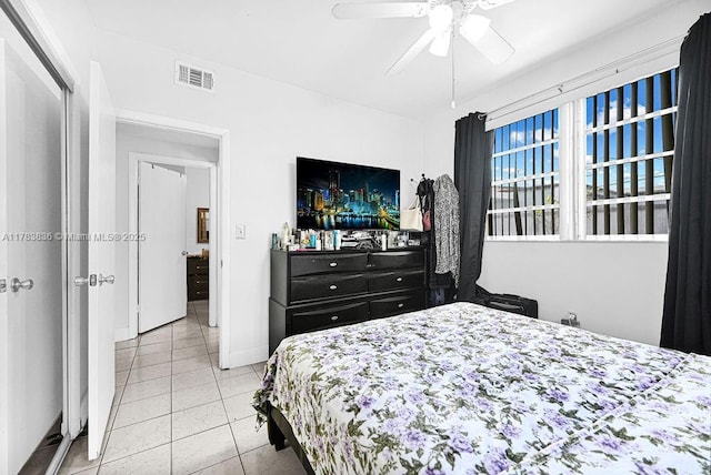5080 E 5th Ave, Hialeah, FL 33013 - tiled bedroom featuring ceiling fan and baseboards