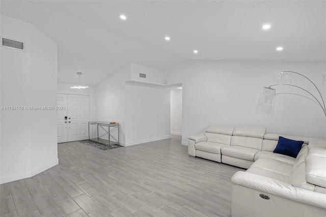 living area featuring visible vents, baseboards, recessed lighting, and lofted ceiling