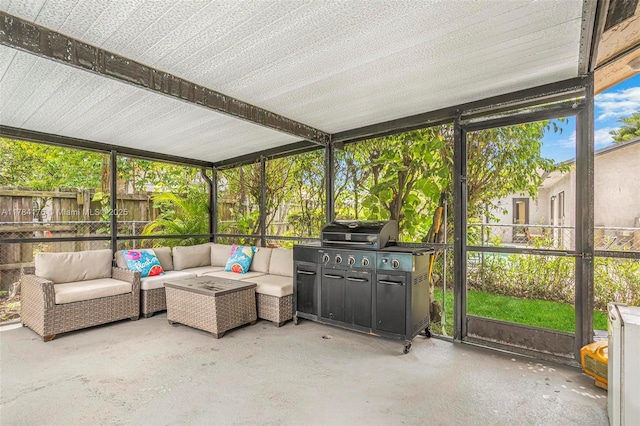 sunroom with an outdoor living space