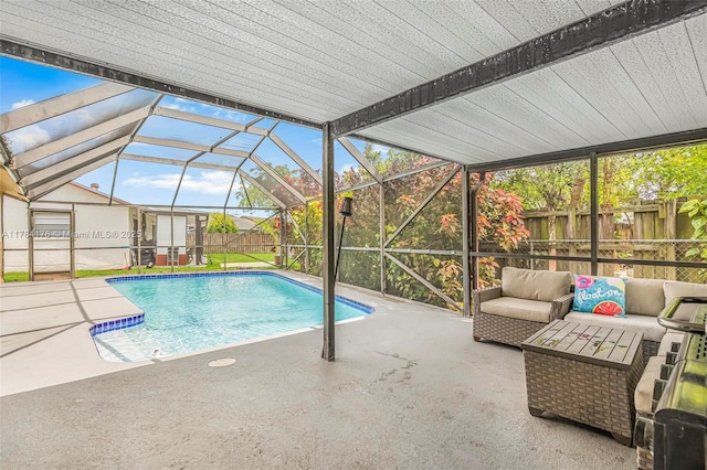 view of swimming pool featuring a patio area, a fenced backyard, and an outdoor hangout area