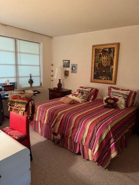 bedroom featuring carpet