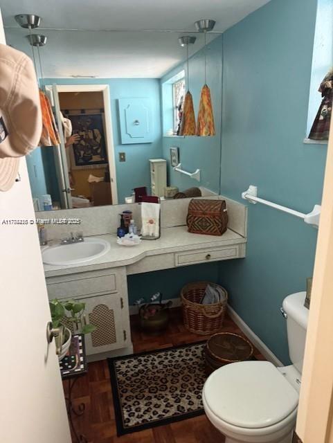 bathroom with toilet and vanity
