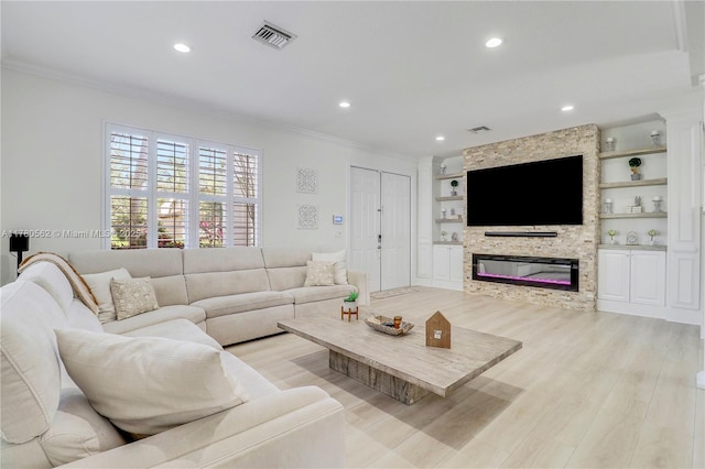 living area featuring ornamental molding, recessed lighting, and visible vents