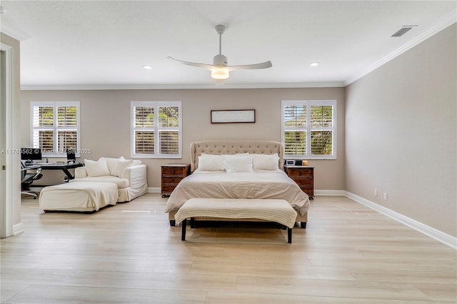 bedroom featuring baseboards, multiple windows, and ornamental molding