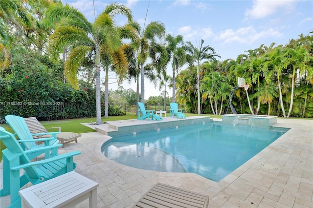 view of swimming pool with a yard, a patio area, a fenced backyard, and a pool with connected hot tub