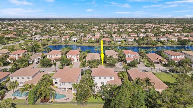 bird's eye view with a residential view and a water view