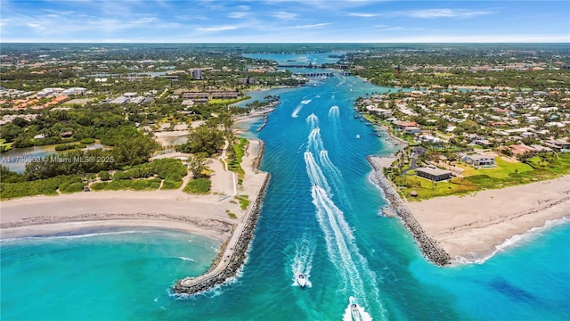 drone / aerial view featuring a water view and a beach view