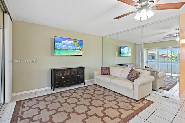 5300 Washington St Unit G323, Hollywood, FL 33021 - tiled living room featuring a ceiling fan and baseboards