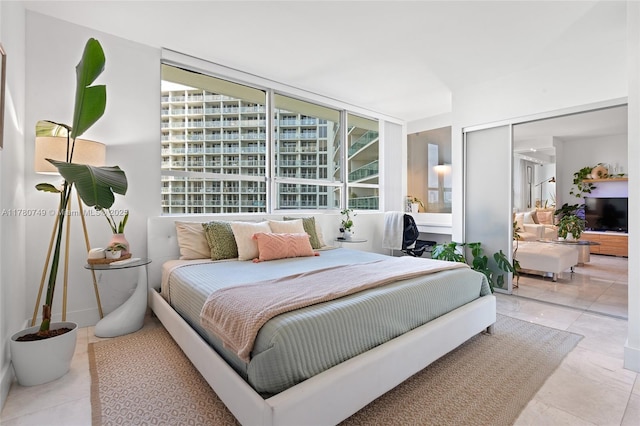1500 Bay Rd Unit 668S, Miami Beach, FL 33139 - tiled bedroom with a closet and multiple windows
