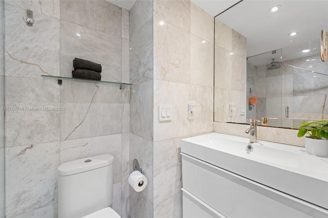 1500 Bay Rd Unit 668S, Miami Beach, FL 33139 - bathroom featuring toilet, tile walls, vanity, recessed lighting, and tiled shower
