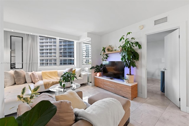 1500 Bay Rd Unit 668S, Miami Beach, FL 33139 - living area with marble finish floor and visible vents