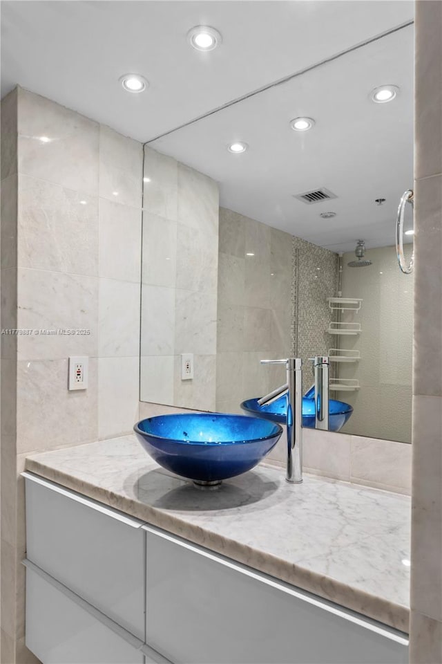 1500 Bay Rd Unit 866S, Miami Beach, FL 33139 - full bathroom featuring tile walls, vanity, and recessed lighting