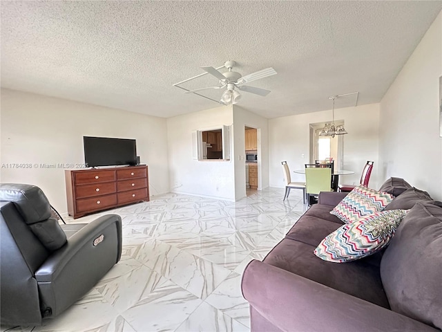 569 N Fanshaw N Unit 569, Boca Raton, FL 33434 - living room featuring a ceiling fan, a textured ceiling, light marble finish flooring, and a chandelier