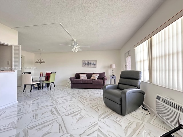 569 N Fanshaw N Unit 569, Boca Raton, FL 33434 - living room with a ceiling fan, a textured ceiling, and a wall unit AC