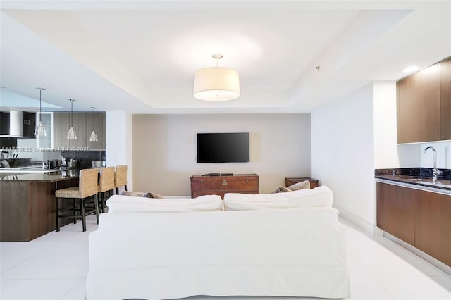 2711 S Ocean Dr Unit 2803, Hollywood, FL 33019 - living room featuring a tray ceiling and light tile patterned floors