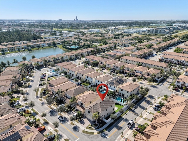 bird's eye view featuring a residential view and a water view