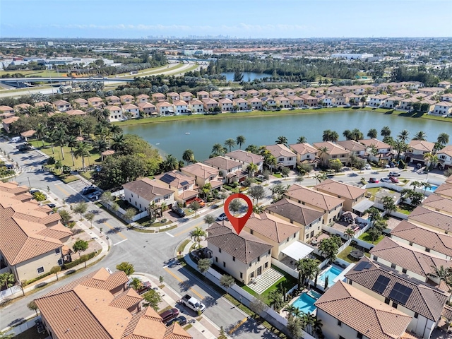 aerial view with a water view and a residential view