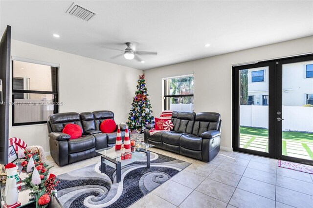 tiled living room with french doors, a ceiling fan, visible vents, and recessed lighting